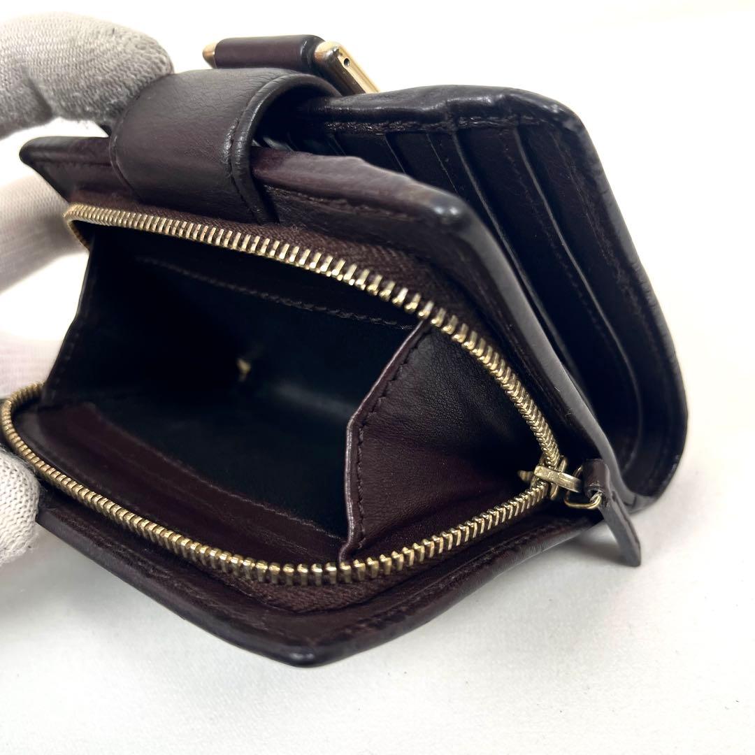 グッチ　二つ折り財布　アビー　シマレザー　ラウンドファスナー　ロゴ　エンボス