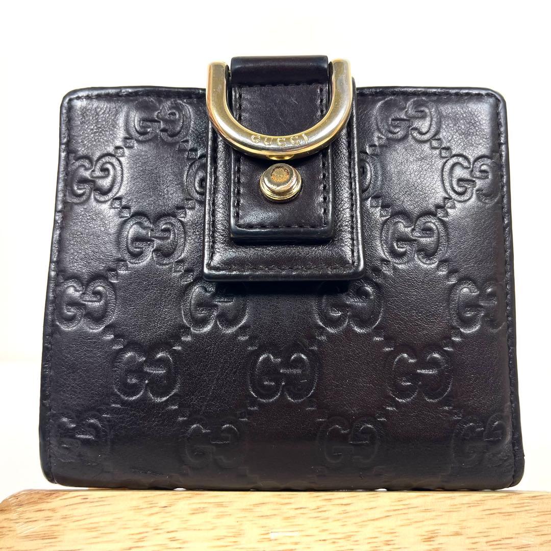 グッチ　二つ折り財布　アビー　シマレザー　ラウンドファスナー　ロゴ　エンボス