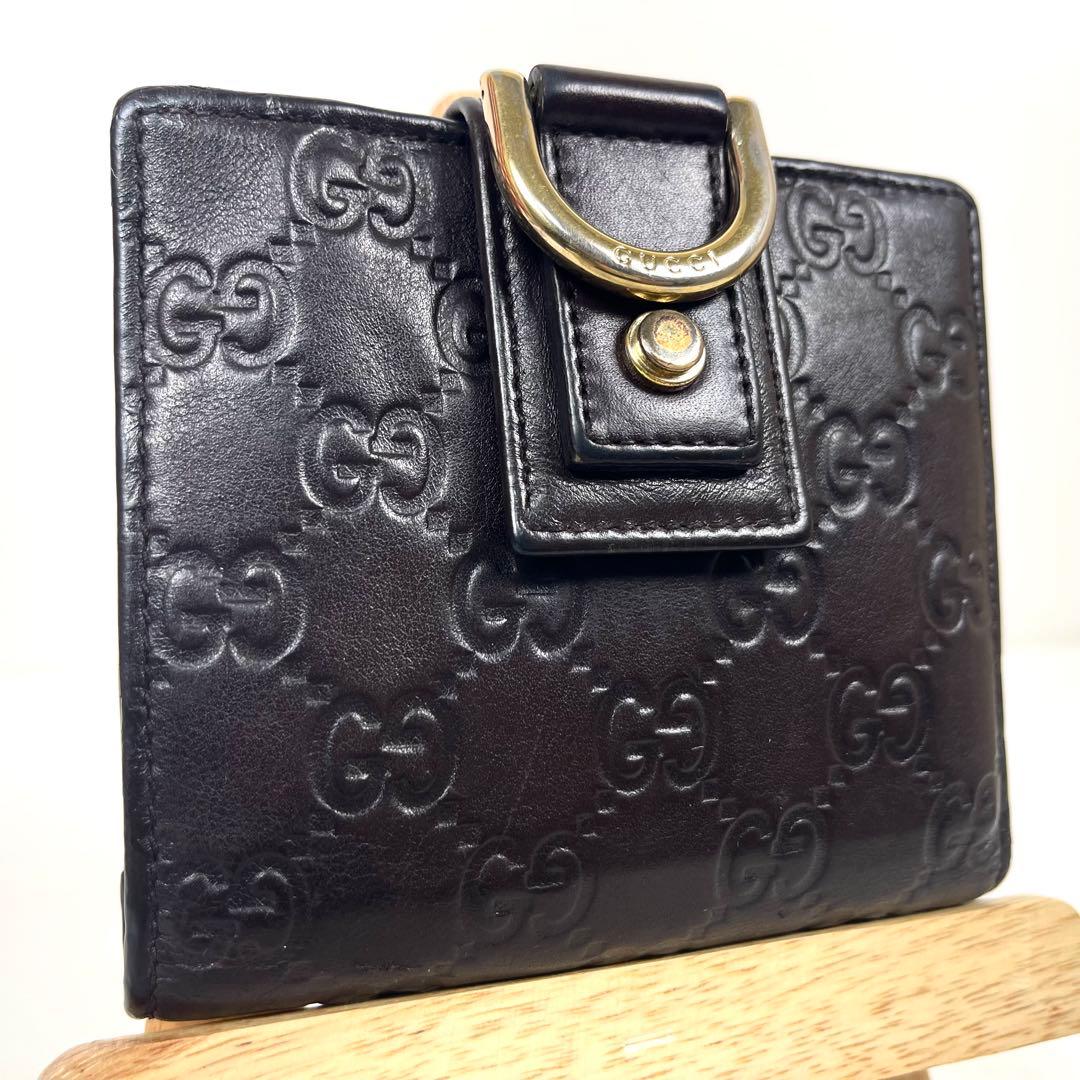 グッチ　二つ折り財布　アビー　シマレザー　ラウンドファスナー　ロゴ　エンボス