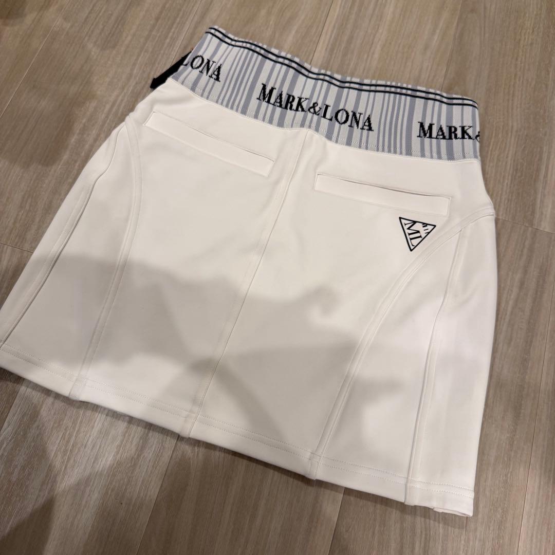 マークアンドロナ　2023年モデル　コードシリーズ　ゴルフ　スカート　ロゴ　金具