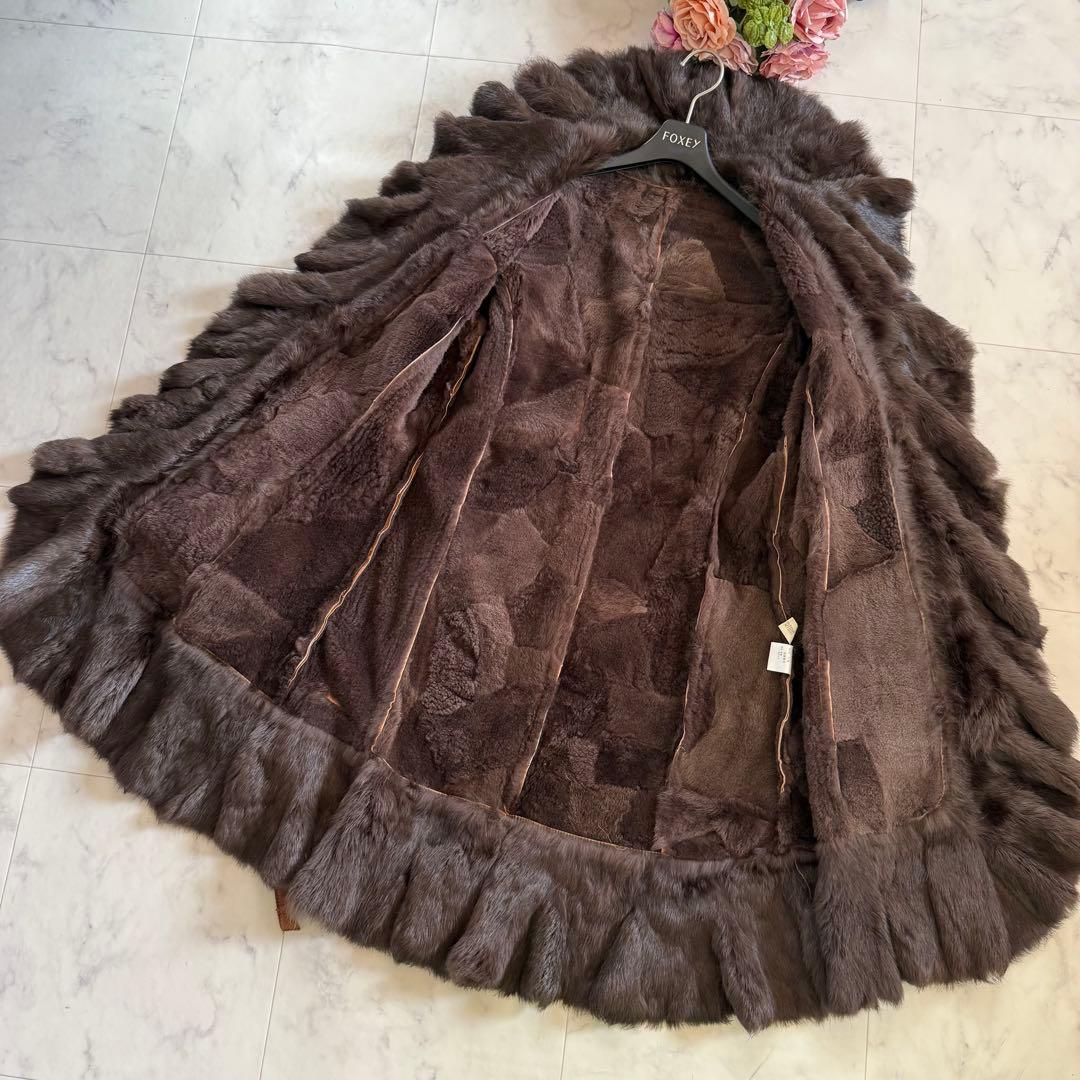 美品★ラビットファー 毛皮 羊革 女優襟 ロングベルテッドコート フリル L