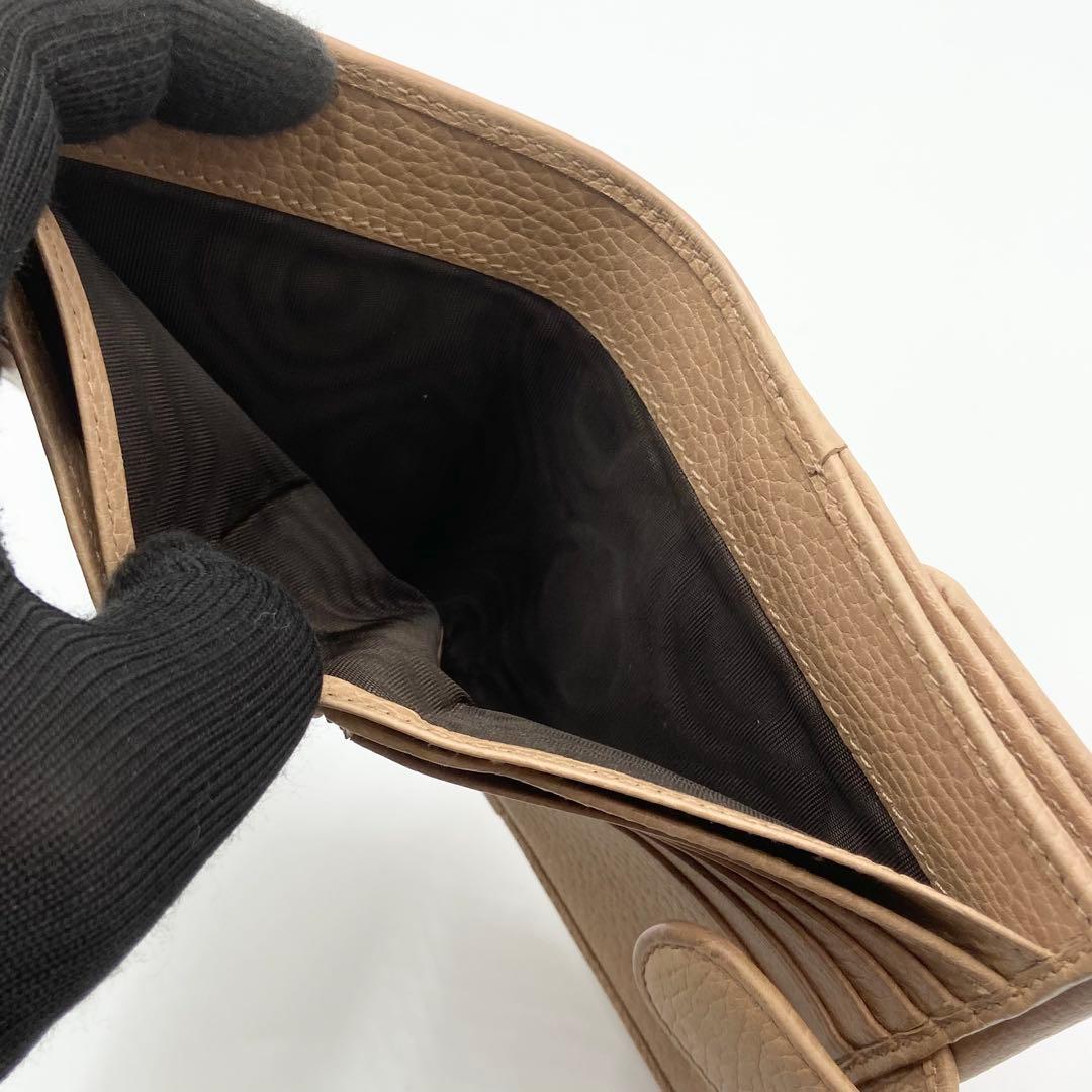 GUCCI インターロッキングG ダラーカーフ 二つ折り財布 ゴールド　ベージュ