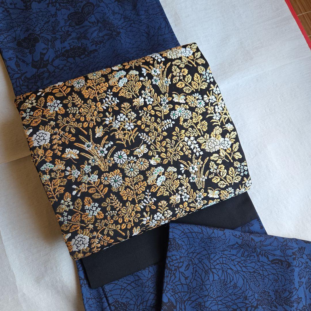 帯屋捨松　細かな煌めきを締める　草花模様の名古屋帯