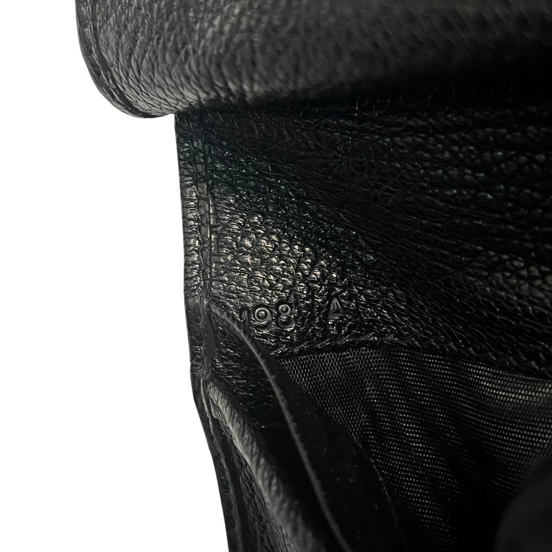 希少✨ミュウミュウ 二つ折り財布 マドラス 総柄 月 ムーン ブラック 黒