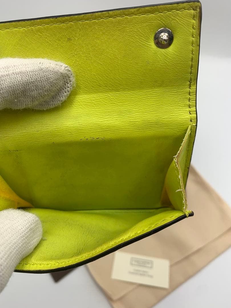 ルイヴィトン タイガラマ ディスカバリーコンパクト イエロー 折り財布 P55