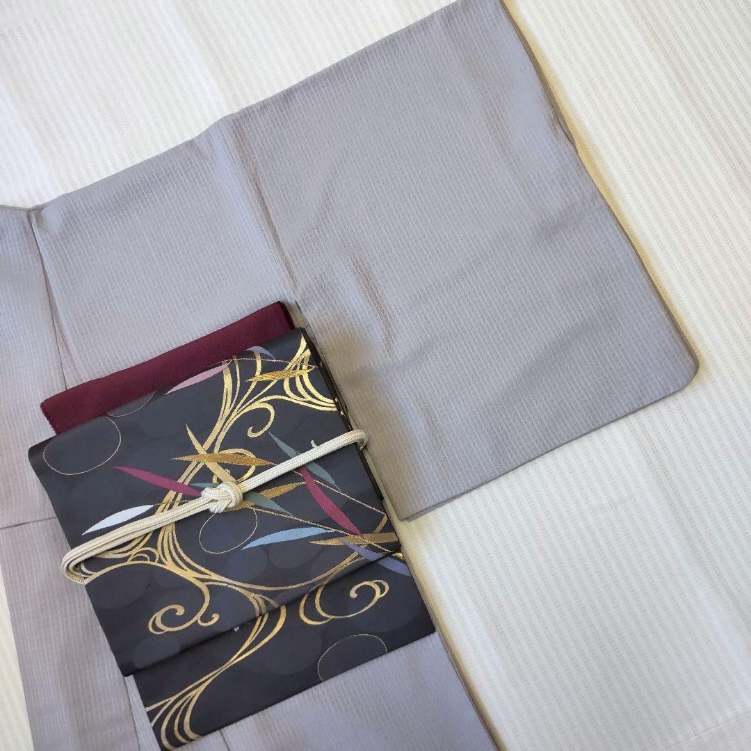 【名古屋帯】未使用品✣クールに流れる金の曲線｜チャコールグレー 流水 358cm