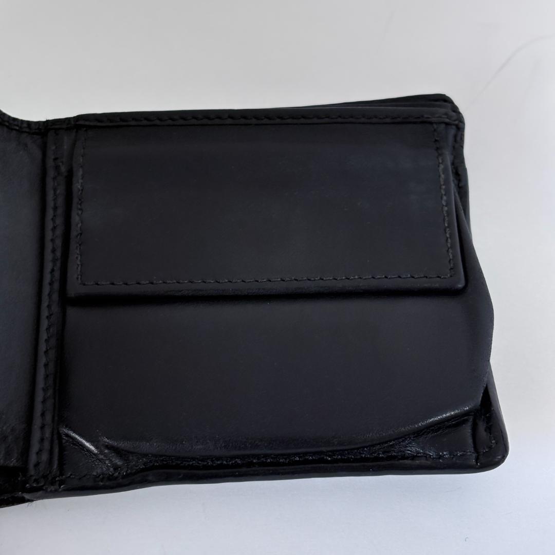 GUCCIのブラックレザー二つ折り財布、GGパターンデザイン