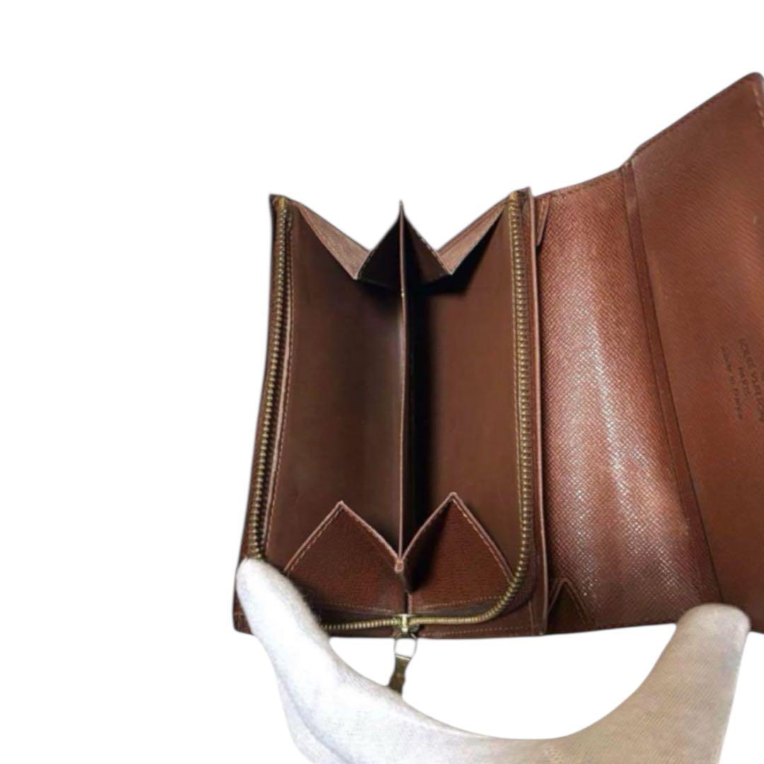 ルイヴィトン　折り財布　ポルトモネビエトレゾール　モノグラム　ブラウン　PVC