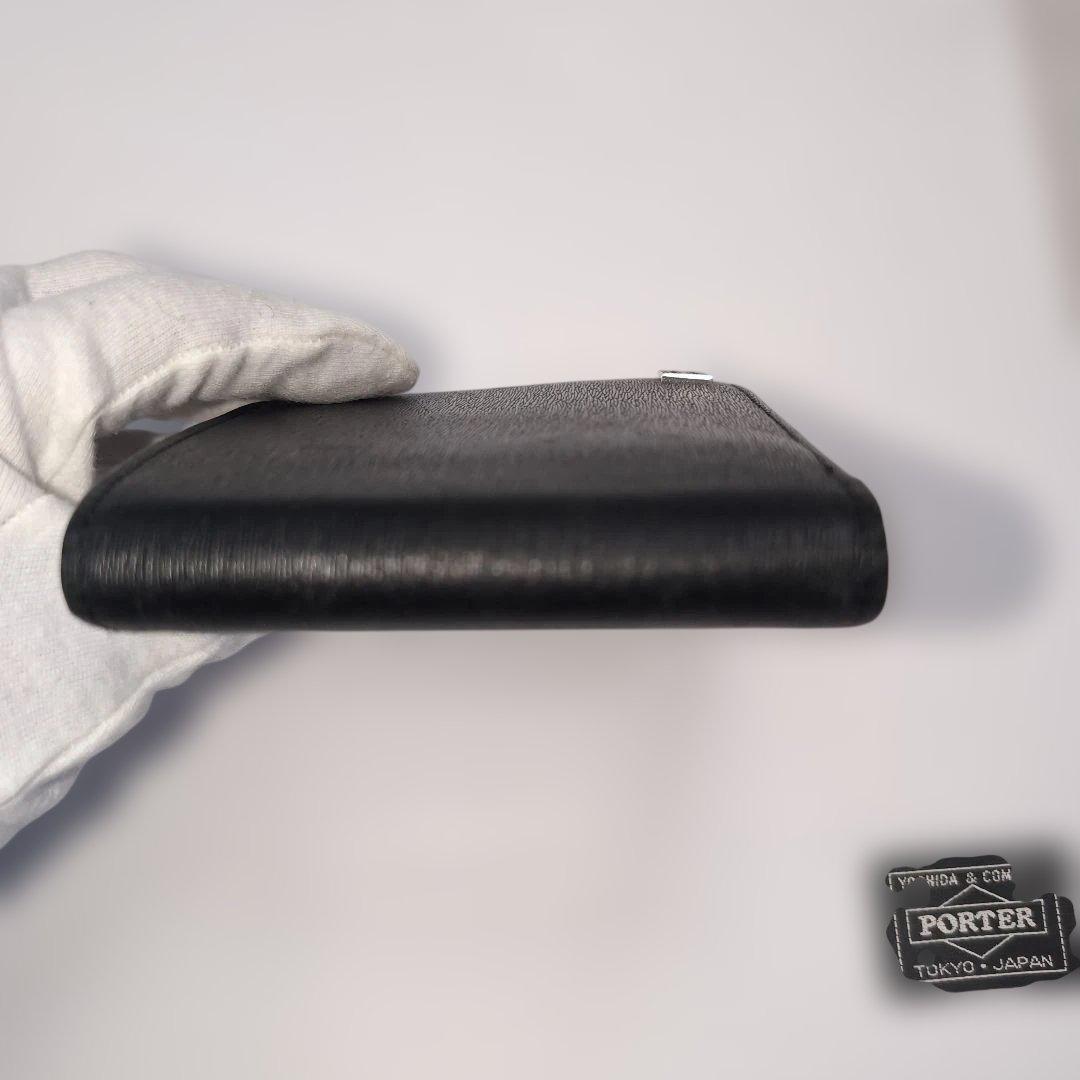 PORTER折り財布　カレント　ブラック　レザー　フラップ　ブランドロゴ金具