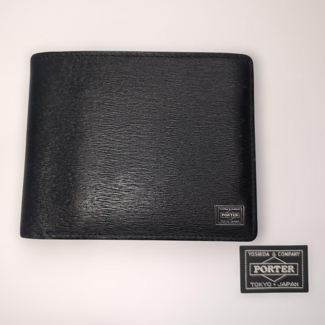 PORTER折り財布　カレント　ブラック　レザー　フラップ　ブランドロゴ金具