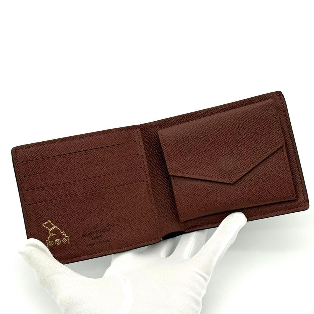 ルイヴィトン 折財布 モノグラム ポルトフォイユ マルコ NM 茶 1973