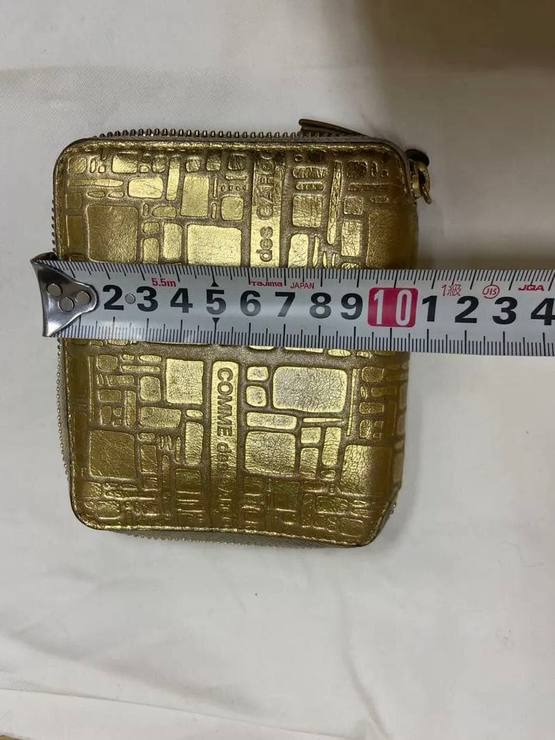 COMME des GARÇONS ゴールド二つ折り財布