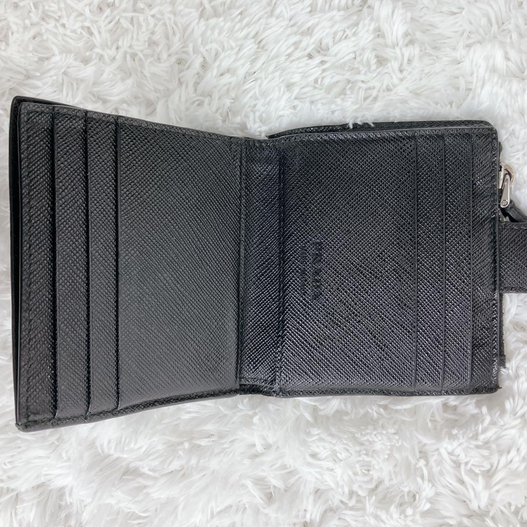 てぃくや プラダ 折り財布 サフィアーノ2MC066メタルロゴ 三角