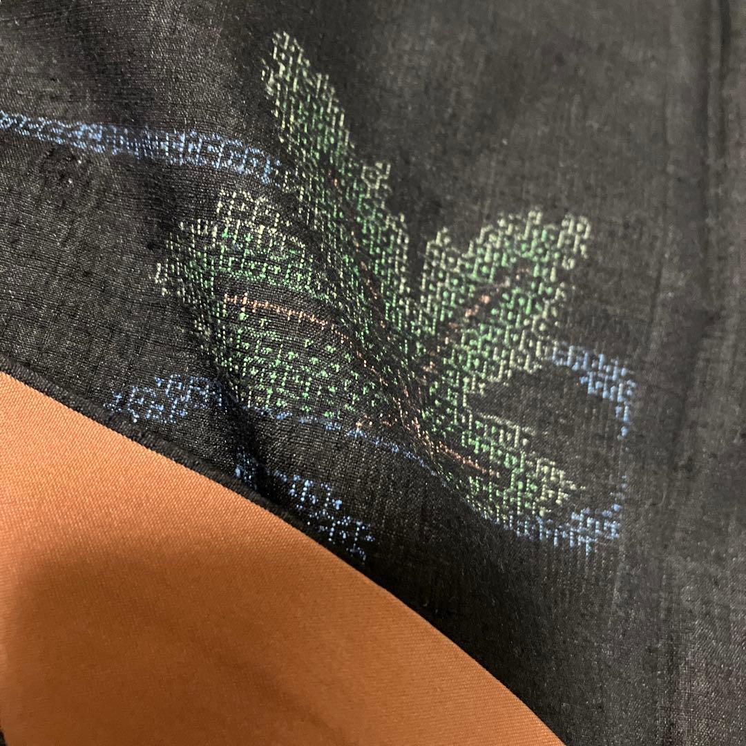 本場結城紬 重要無形文化財 地機 黒地 100亀甲 飛び柄 4色絣 未使用 美品