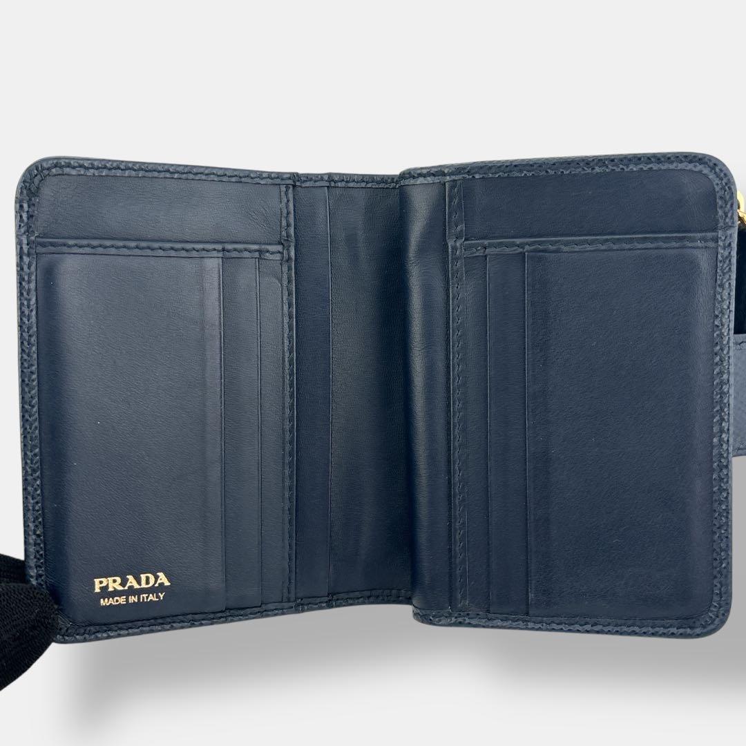 美品 プラダ 二つ折り財布 コンパクト サフィアーノレザー ロゴ 1ML018