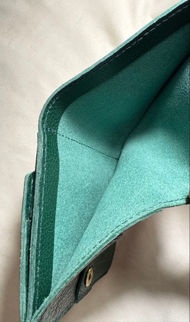 イルビゾンテ　グリーンレザー二つ折り財布 保存袋　オルゴール付き