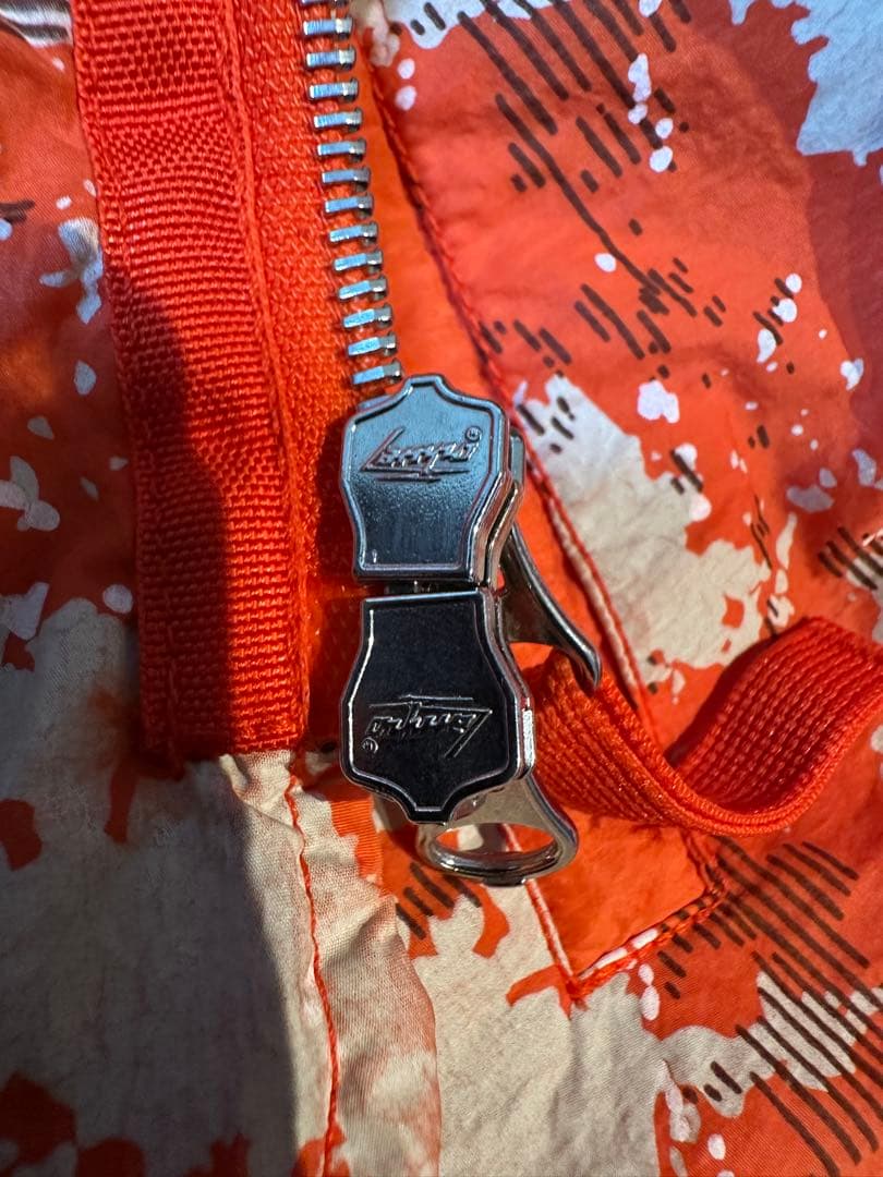 ストーンアイランド シャドウプロジェクト ベスト オレンジ 総柄