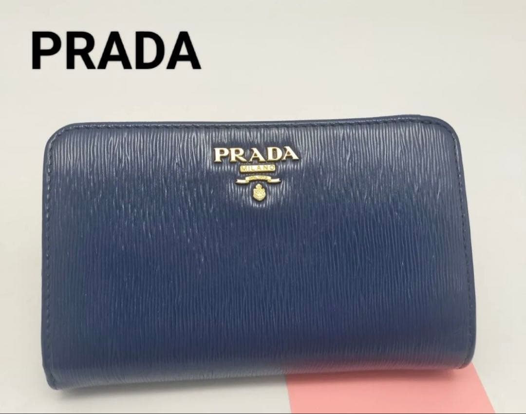 超美品　PRADA サフィアーノレザー　二つ折り財布 ブルーラウンドファスナー
