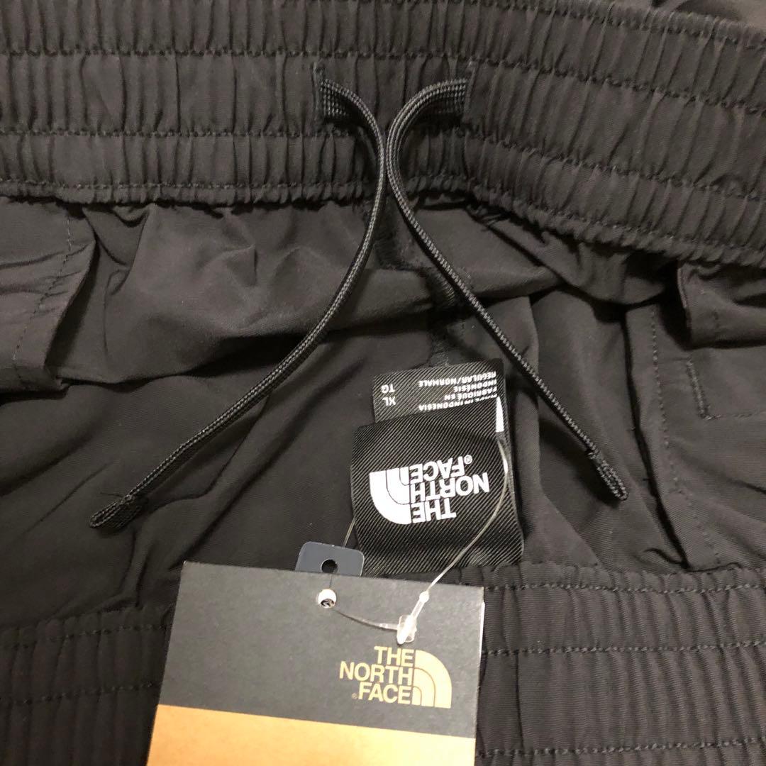 【海外限定】ノースフェイス　ウインドパンツ　刺繍　日本XXL相当　A520
