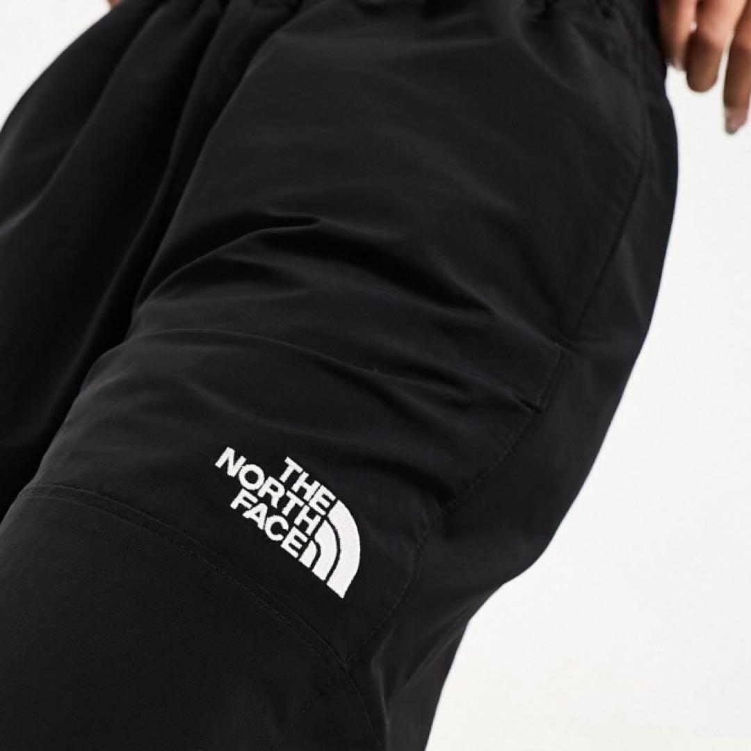 【海外限定】ノースフェイス　ウインドパンツ　刺繍　日本XXL相当　A520