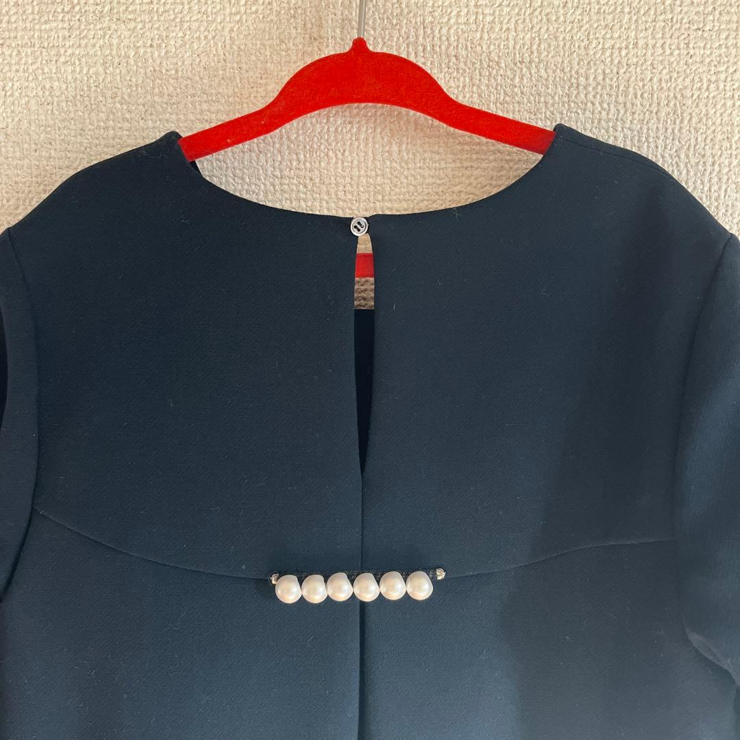 紺色のAラインワンピース 長袖 バックパール装飾付き130〜140