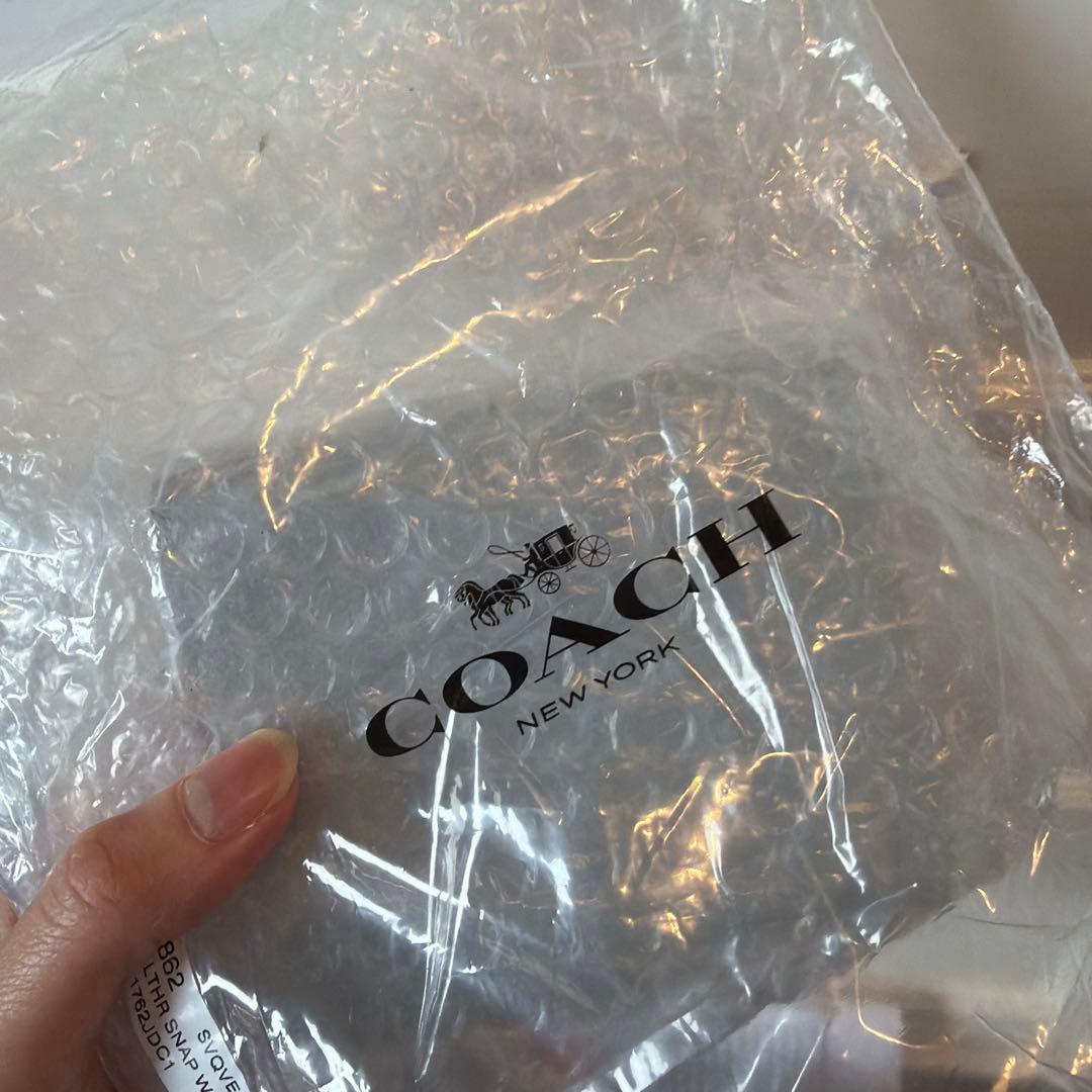 【新品未使用】COACH 二つ折り財布 ライトブルー