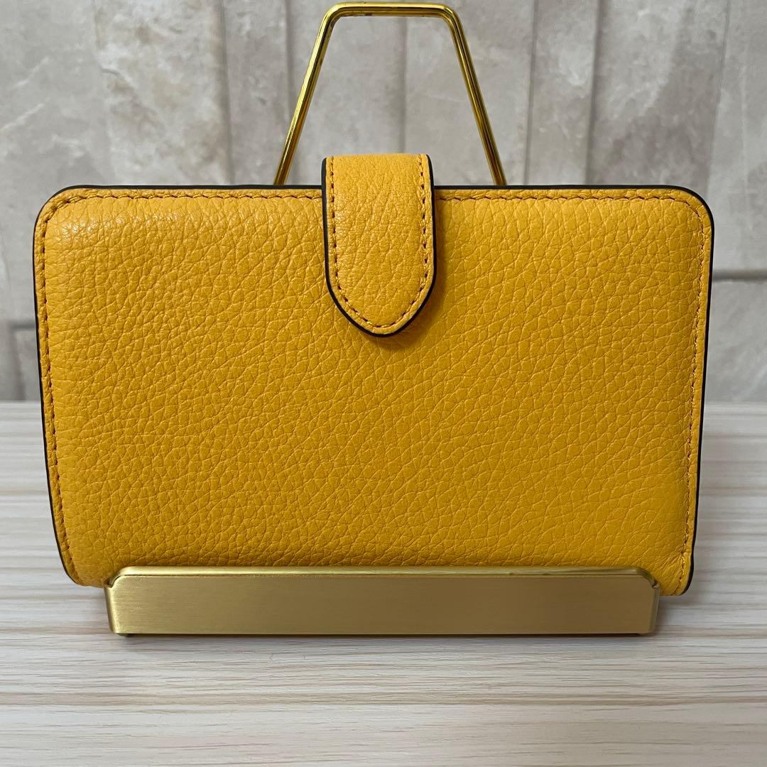 早い者勝ち！訳あり新品 kate spade 二つ折り財布 イエロー