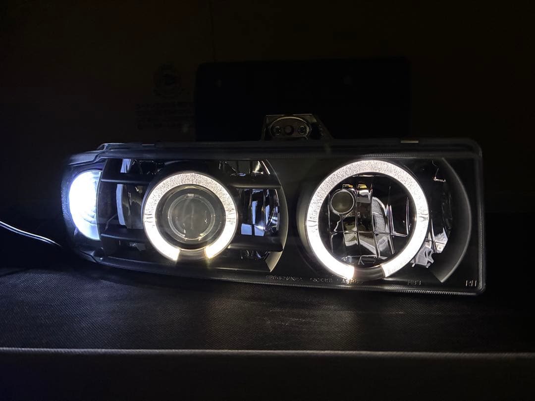 シボレーアストロGMCサファリ用ヘッドライトイカリング付左右セット 社外品