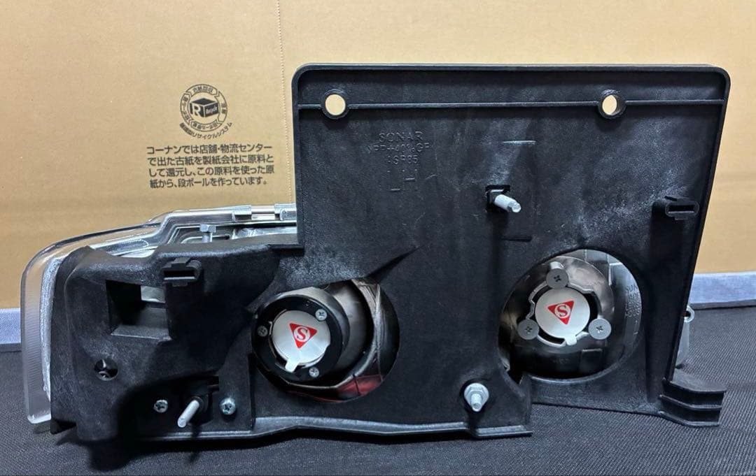 シボレーアストロGMCサファリ用ヘッドライトイカリング付左右セット 社外品