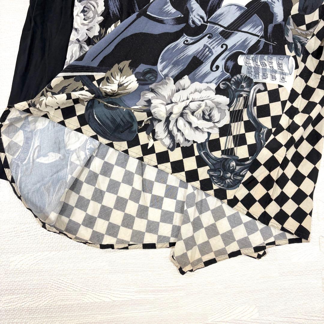 トクコプルミエヴォル✨デザインチュニック　ブラウス　総柄　音楽家　変形　9号