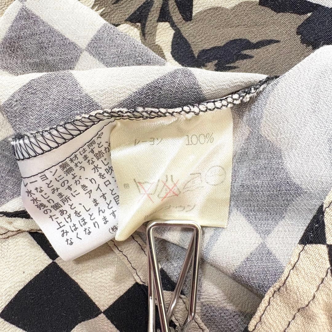 トクコプルミエヴォル✨デザインチュニック　ブラウス　総柄　音楽家　変形　9号