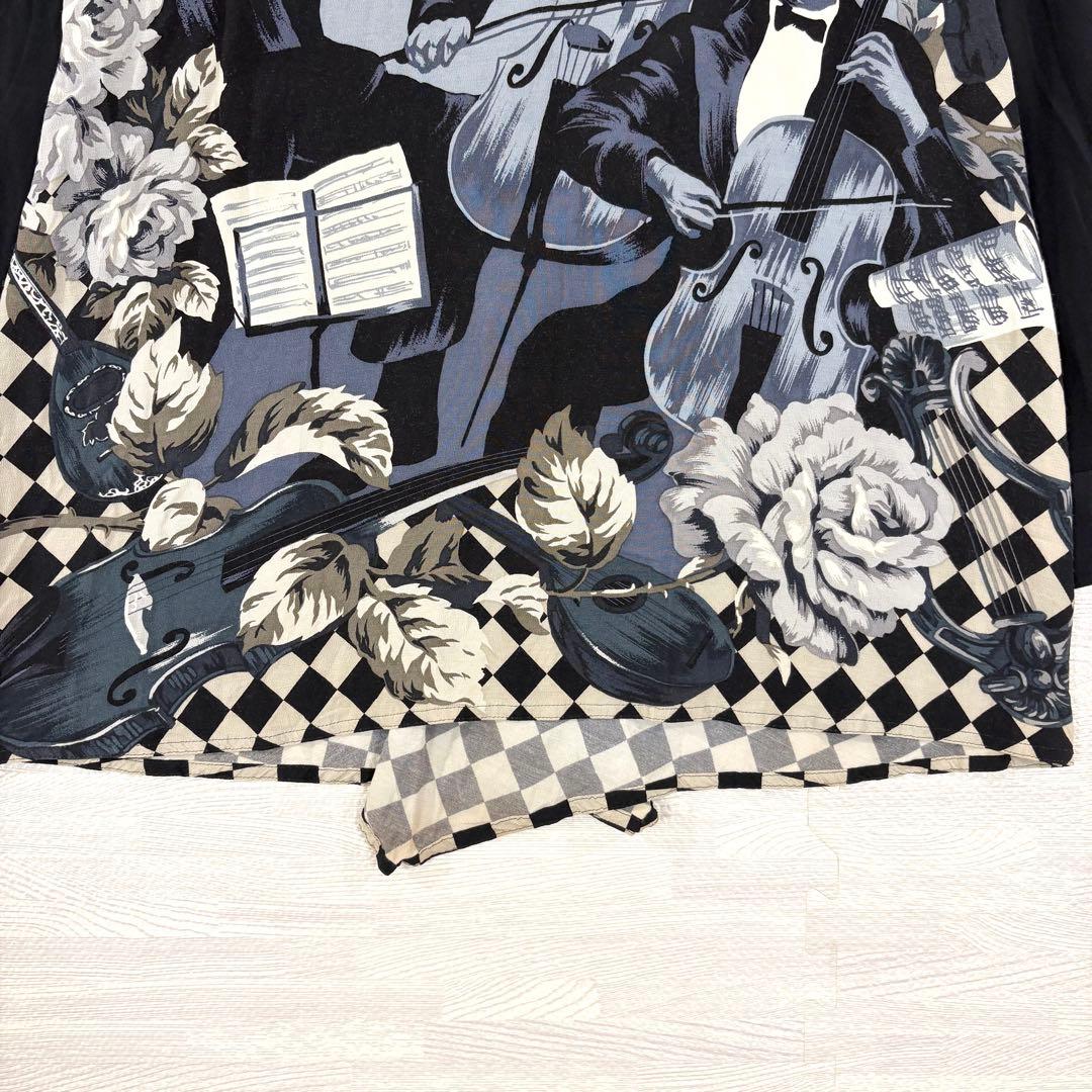 トクコプルミエヴォル✨デザインチュニック　ブラウス　総柄　音楽家　変形　9号