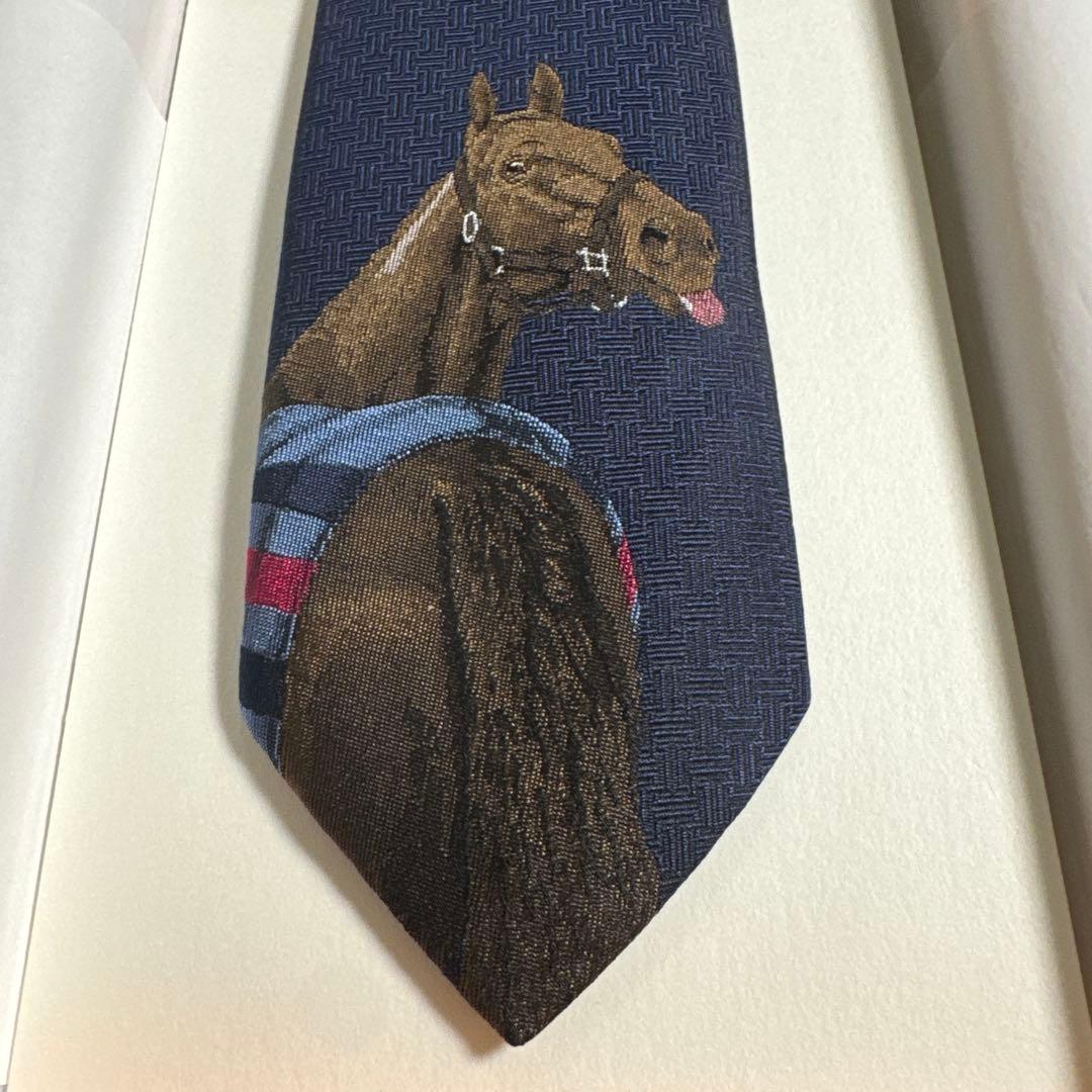 HERMESエルメス紺色ロカバール・デイ•リール ネクタイ シルク100％馬7㎝