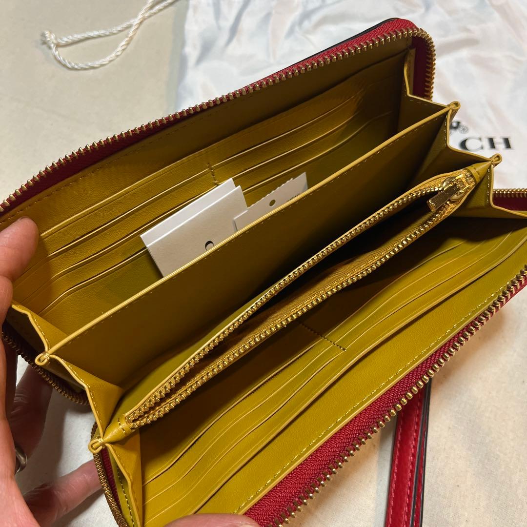 COACHストラップ付長財布 ディズニーキースヘリングコラボ