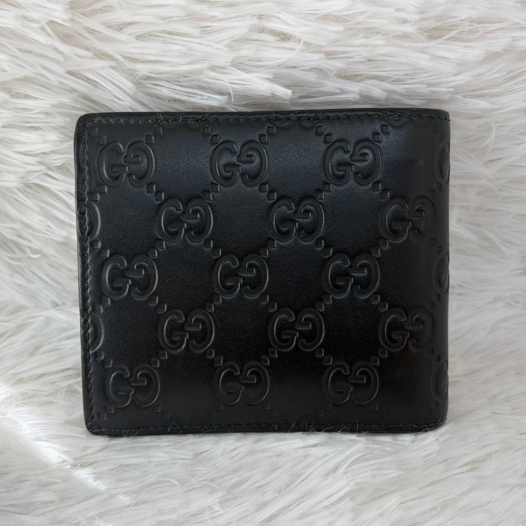未使用級✨️ グッチ　二つ折り　シマ　小銭入れ　ドリアン　型押し　レザー　黒