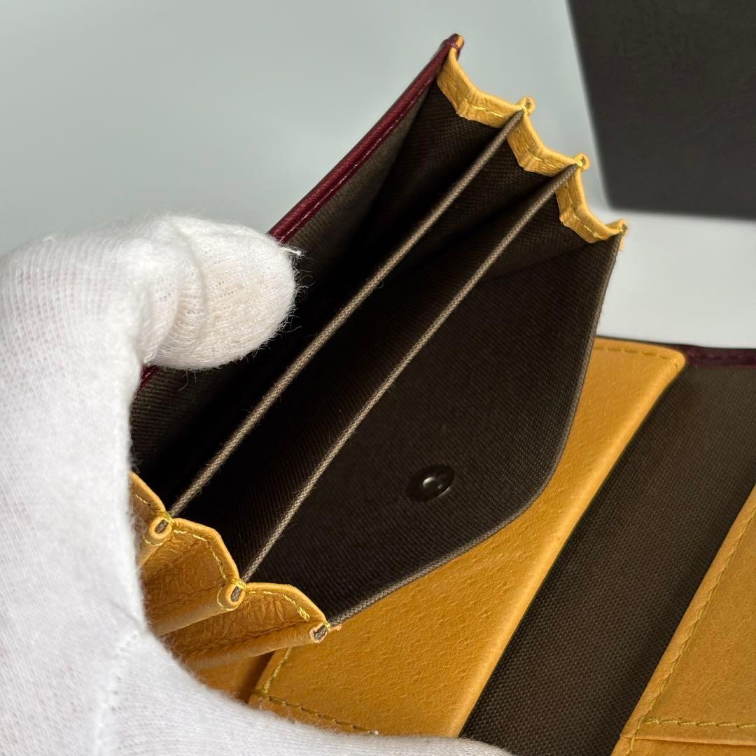 m+ エムピウ ミッレフォッリエⅡ P25 ワイン イエロー 二つ折り財布