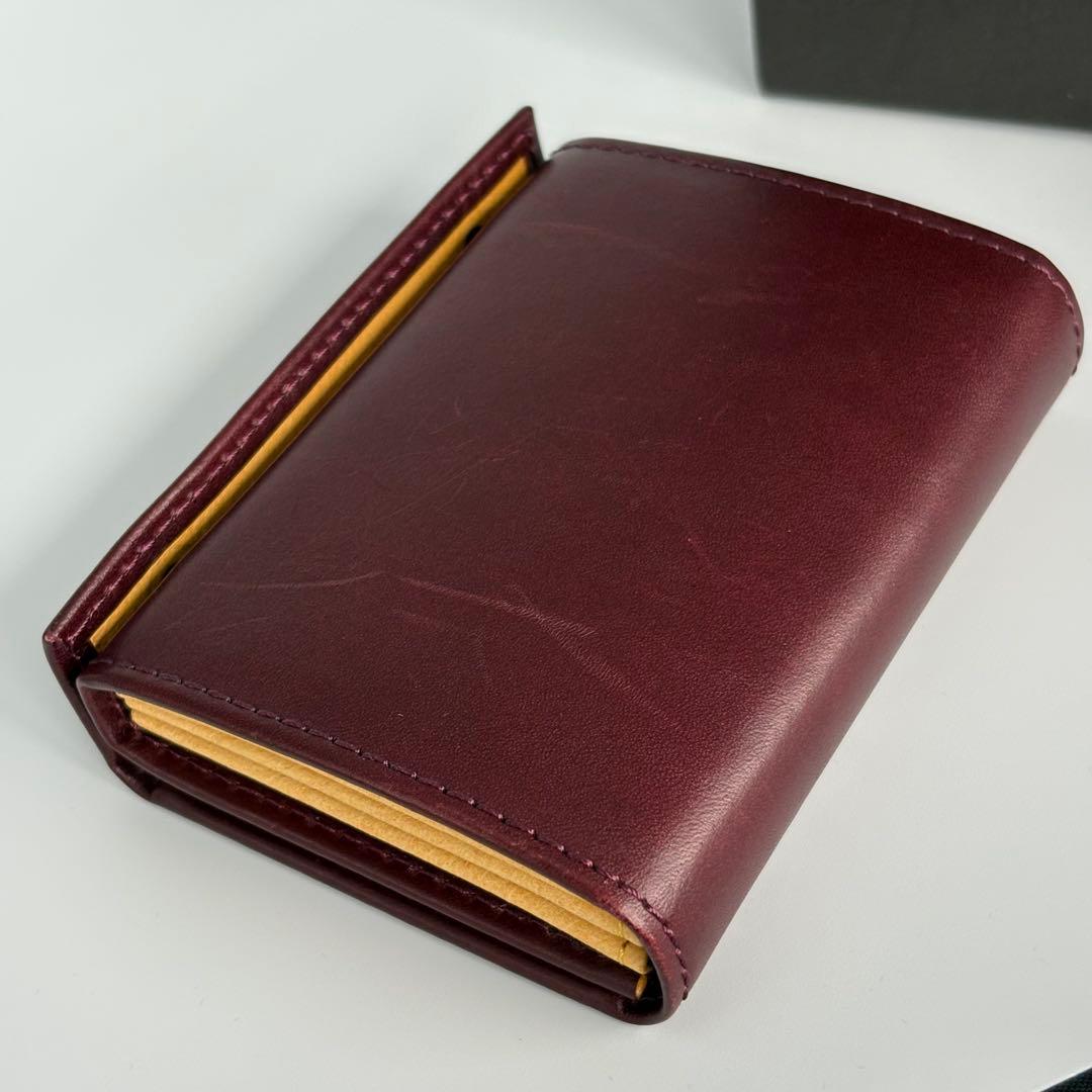 m+ エムピウ ミッレフォッリエⅡ P25 ワイン イエロー 二つ折り財布