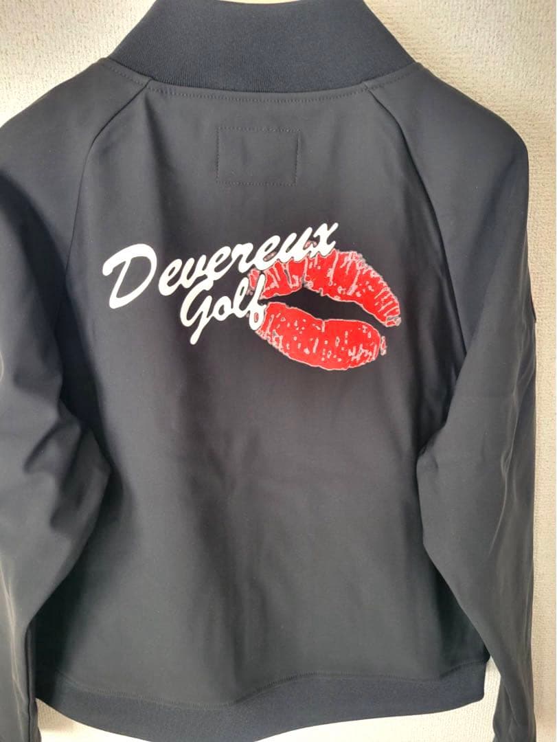 新品未使用【デヴァロー ゴルフ】レディース バッグプリントリップブルゾン 黒 Ｍ