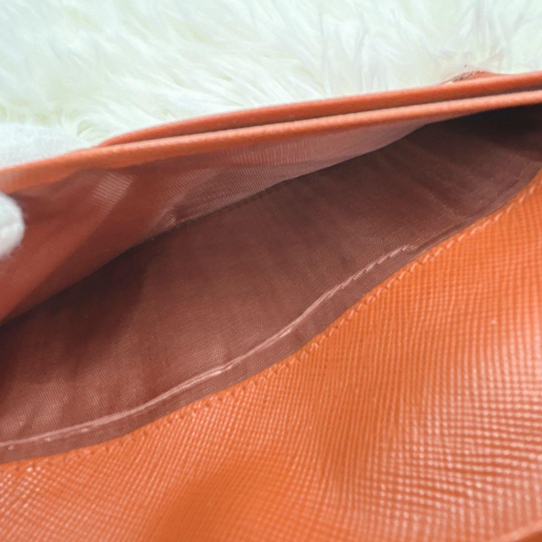 プラダ 長財布 サフィアーノ フィオッコ レッド メタルロゴ リボン