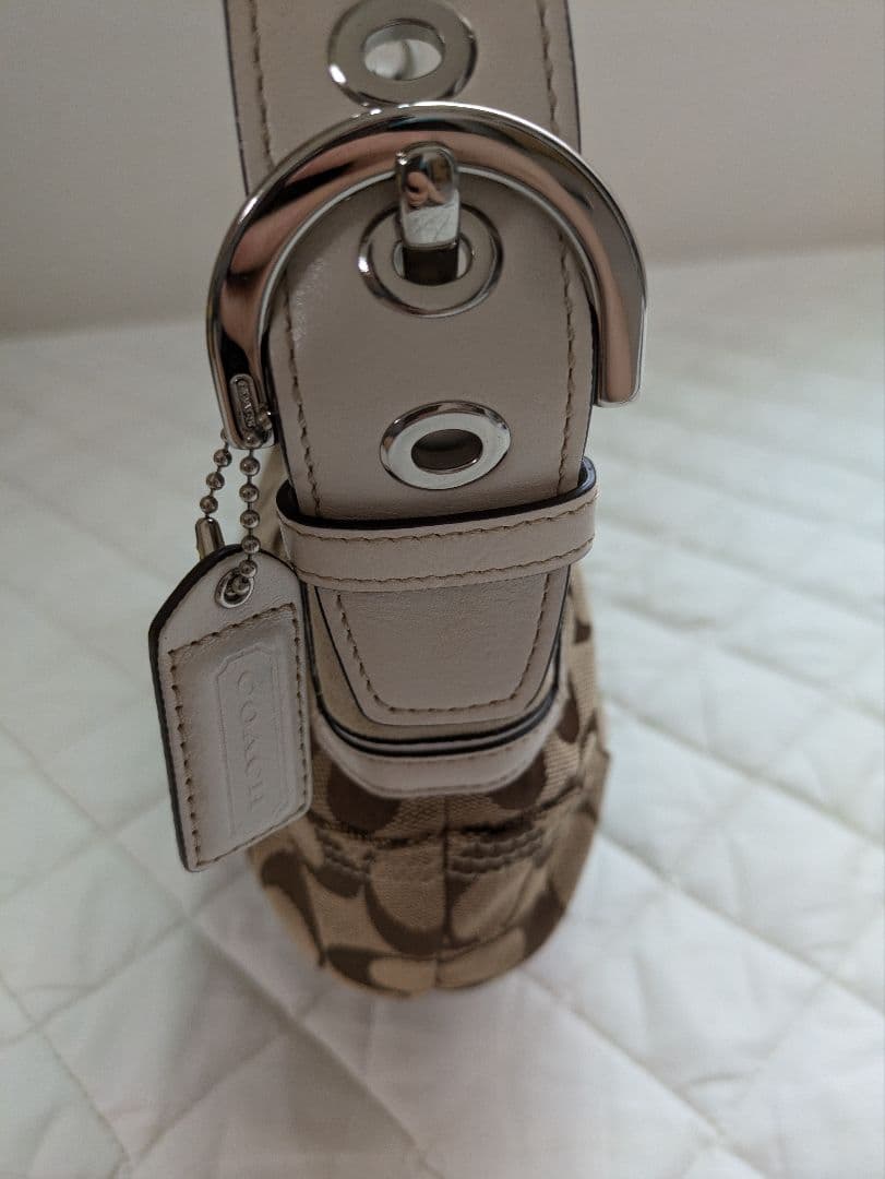 コーチcoach茶色シグネチャー模様キャンバス 半円形スモールホーボーバッグ