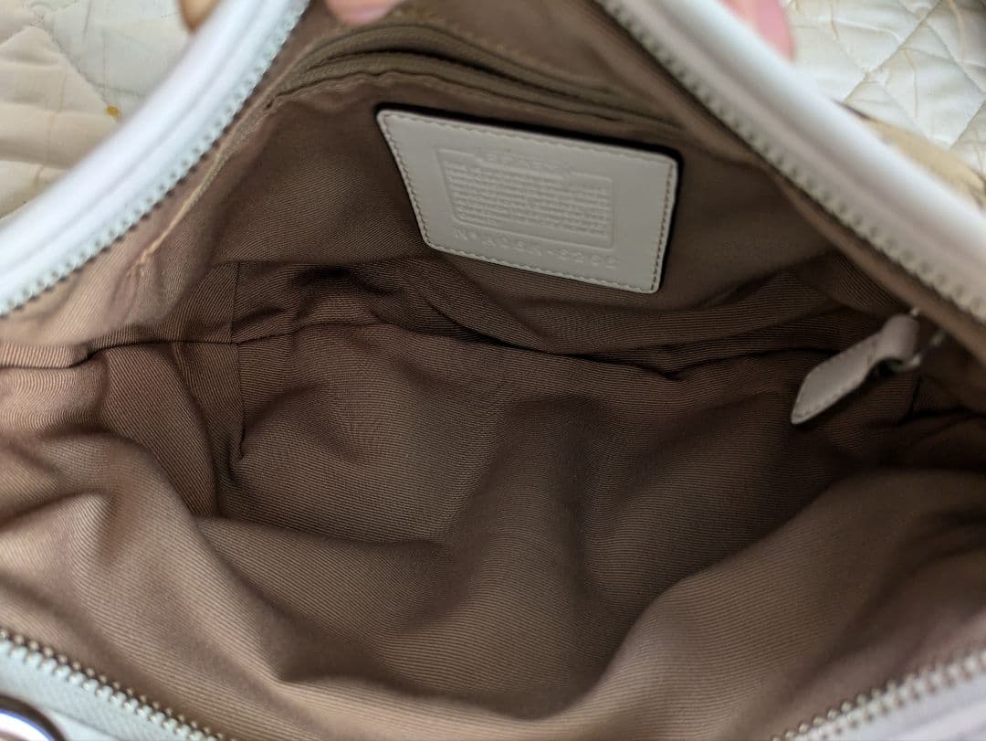 コーチcoach茶色シグネチャー模様キャンバス 半円形スモールホーボーバッグ