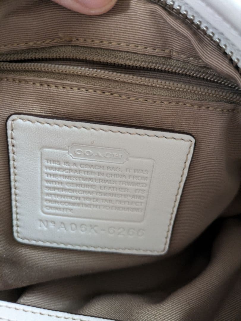 コーチcoach茶色シグネチャー模様キャンバス 半円形スモールホーボーバッグ