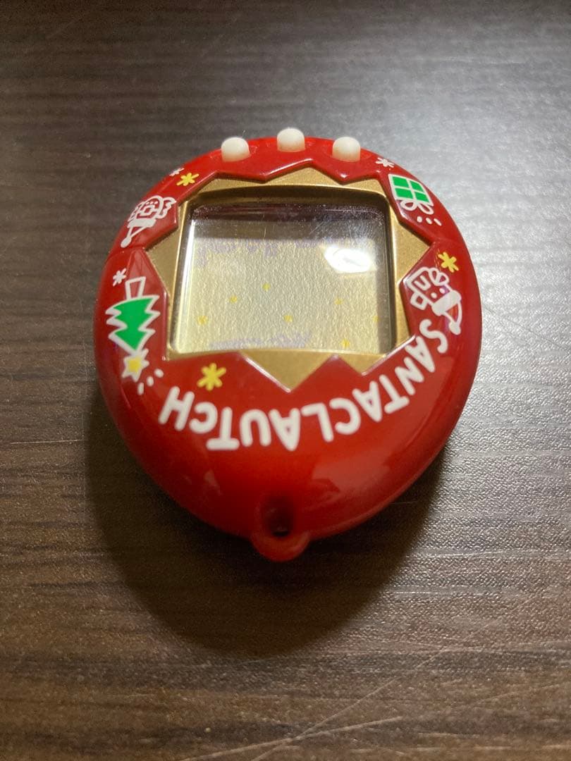 【動作確認済・ジャンク】サンタクロっちのたまごっち　レッド　※裏蓋両側ビス欠け