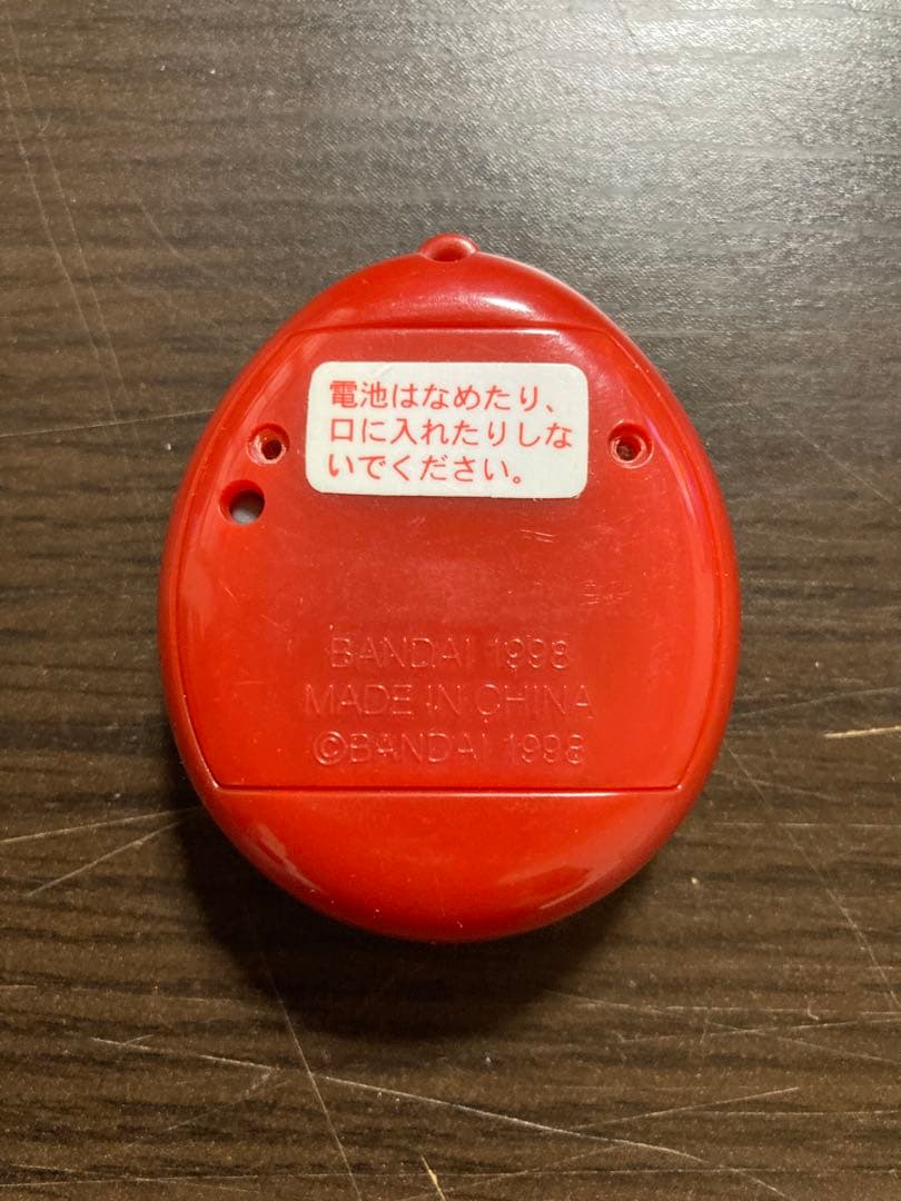 【動作確認済・ジャンク】サンタクロっちのたまごっち　レッド　※裏蓋両側ビス欠け