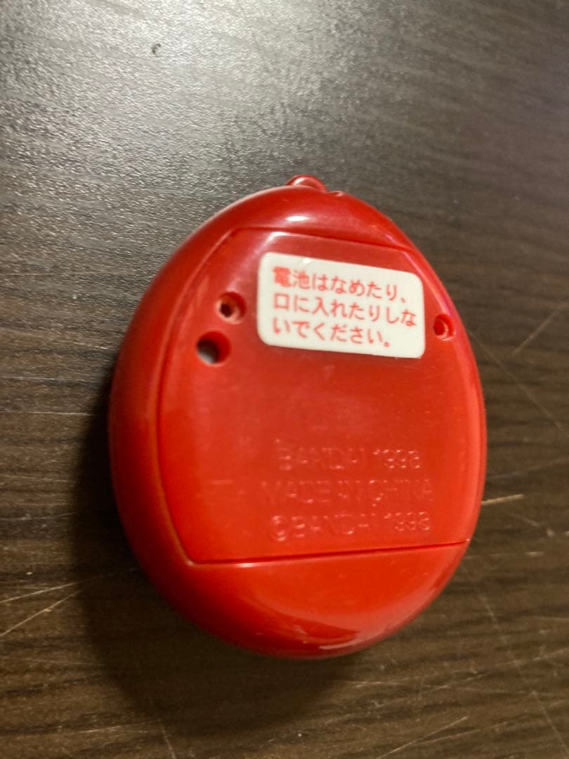 【動作確認済・ジャンク】サンタクロっちのたまごっち　レッド　※裏蓋両側ビス欠け