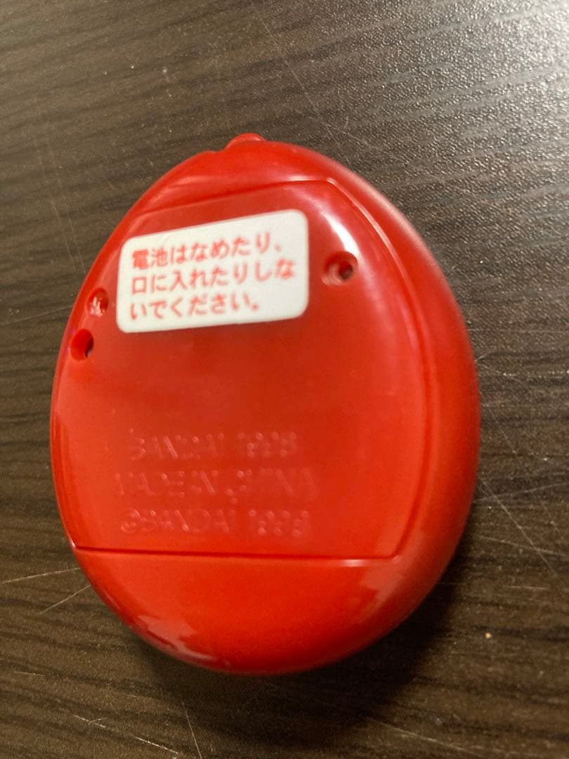 【動作確認済・ジャンク】サンタクロっちのたまごっち　レッド　※裏蓋両側ビス欠け