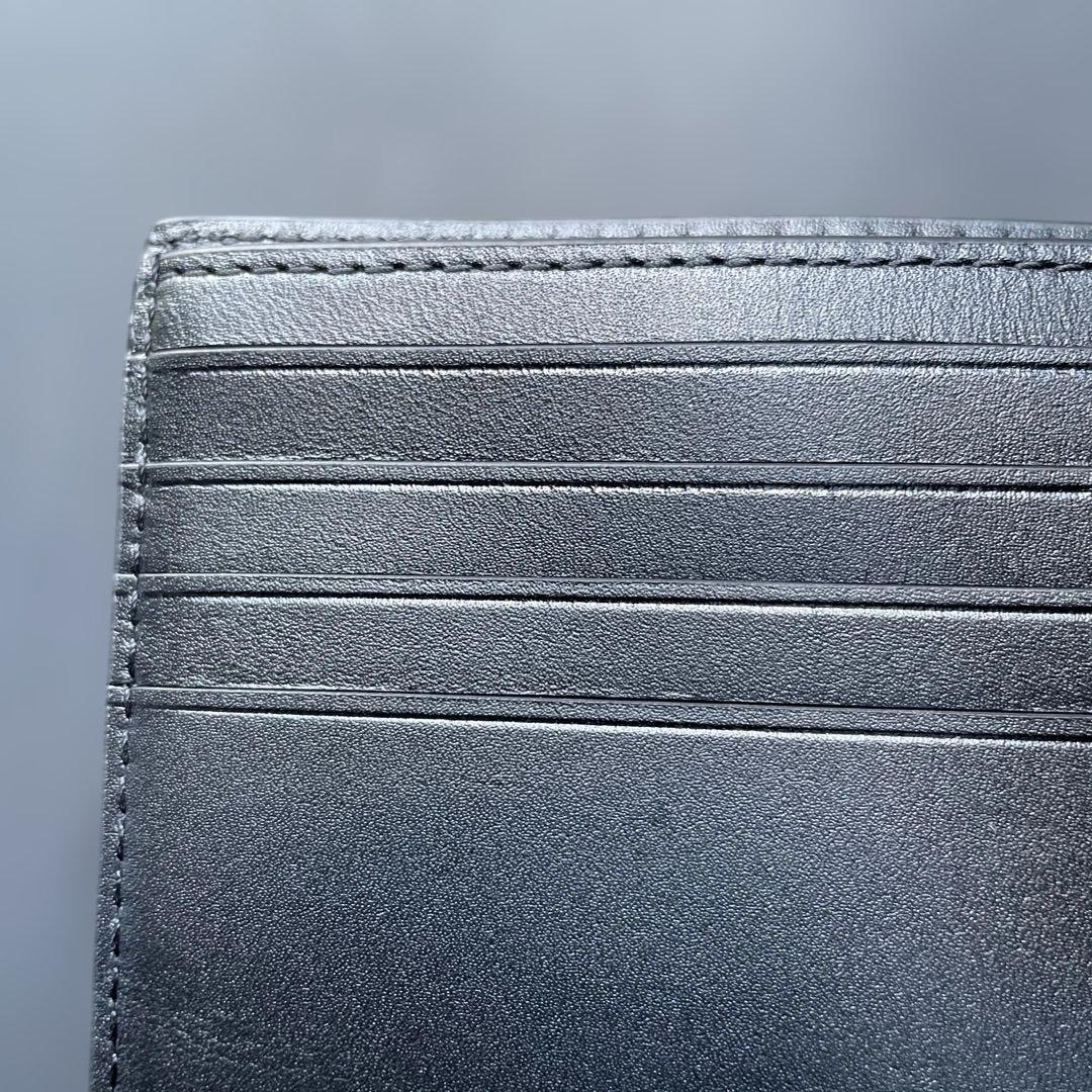 新品　定価55,000円　COACH ブラック　二つ折り財布 エンボス加工