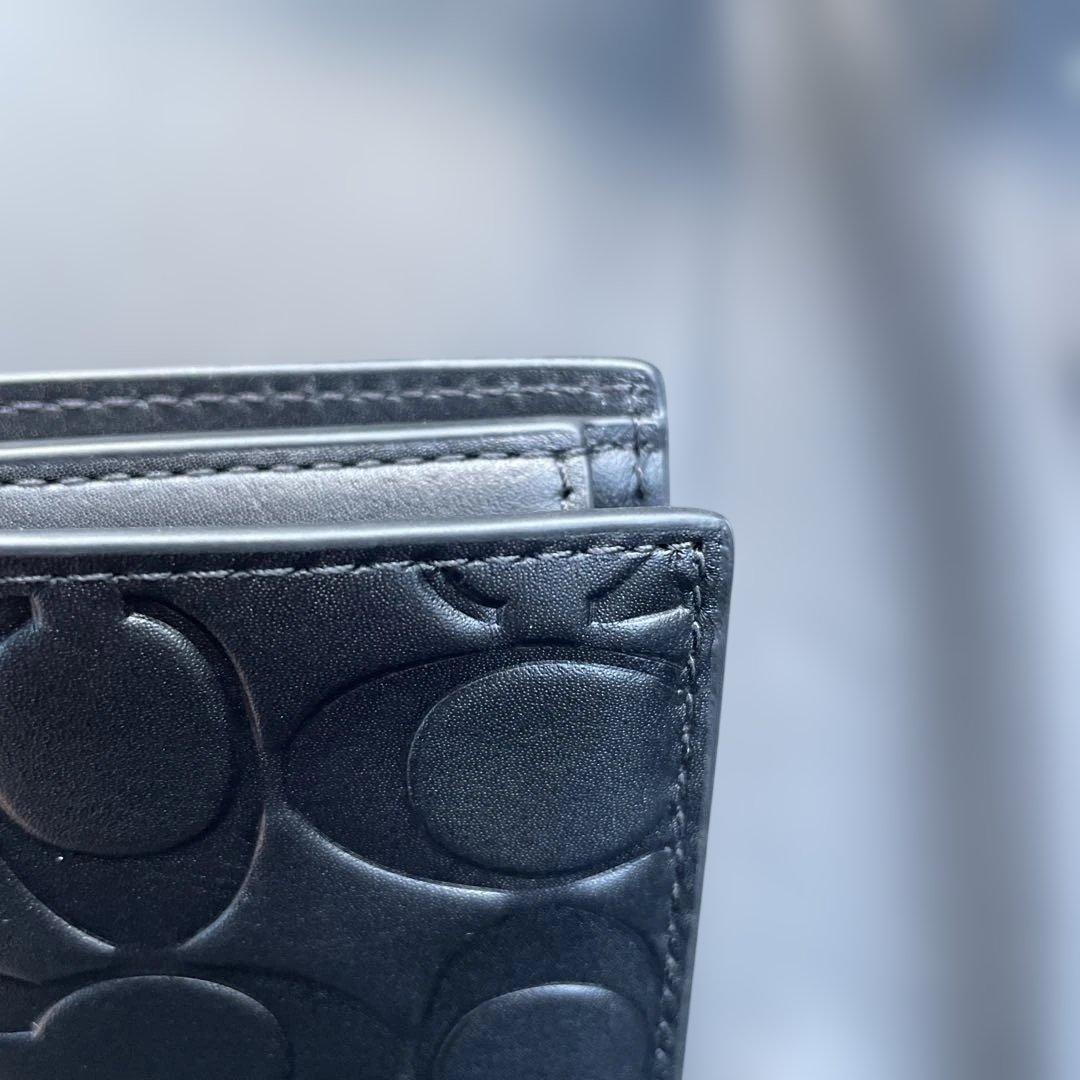 新品　定価55,000円　COACH ブラック　二つ折り財布 エンボス加工