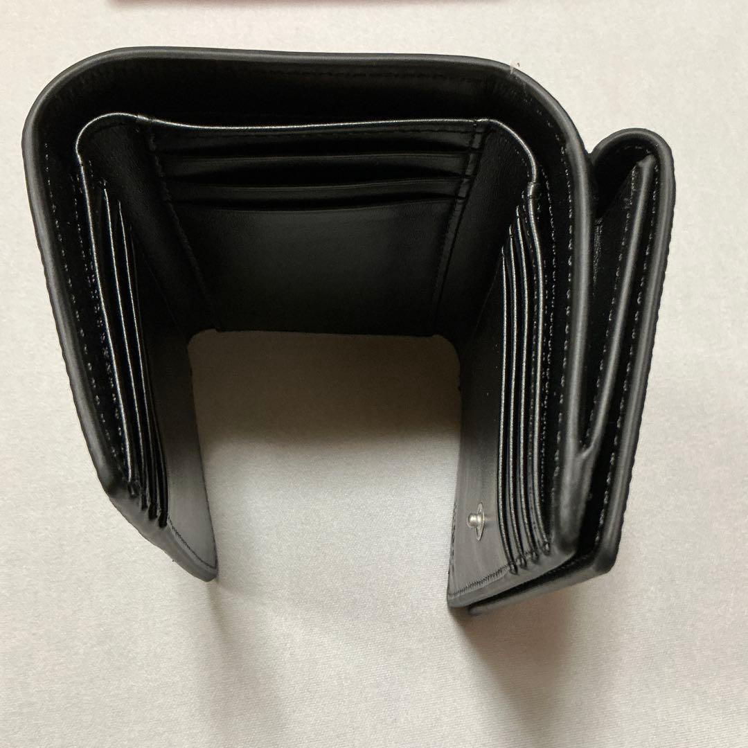 洗練されたデザイン　DIESEL TRI-FOLD COINS S X09664