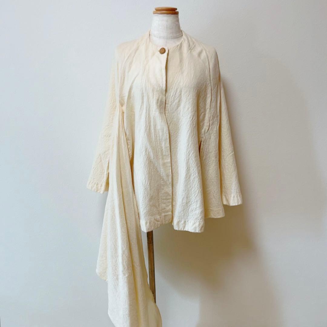 コズミックワンダー ライトソース 圧縮コットンポンチョマントコート オフホワイト